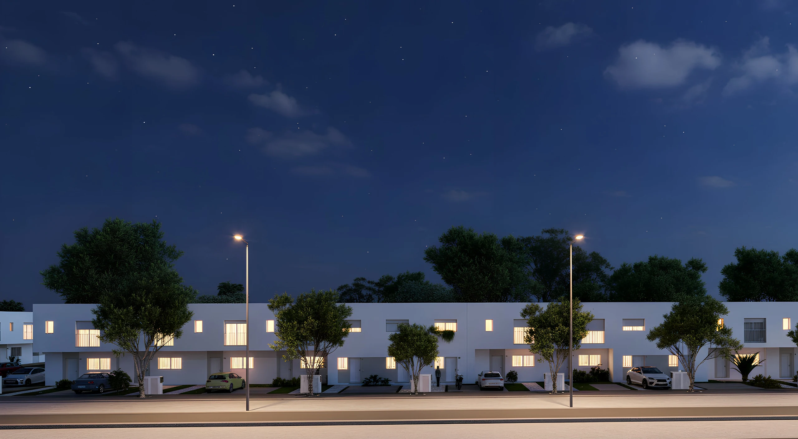 Vista exterior nocturna del residencial